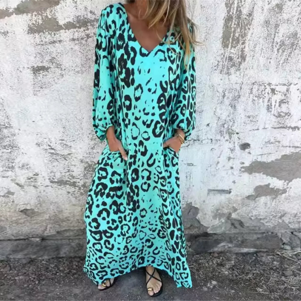 Close-up detail of a turquoise leopard print maxi dress fabric and fit